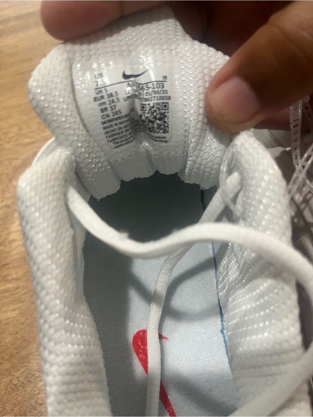 Nike Kids White Sneakers with Red Swoosh Accent